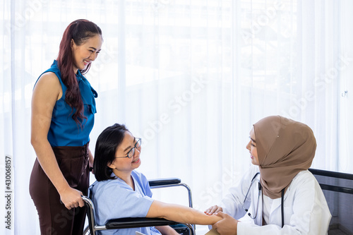 Senior woman patient with relative daughter having consultation with doctor in office clinic hospital