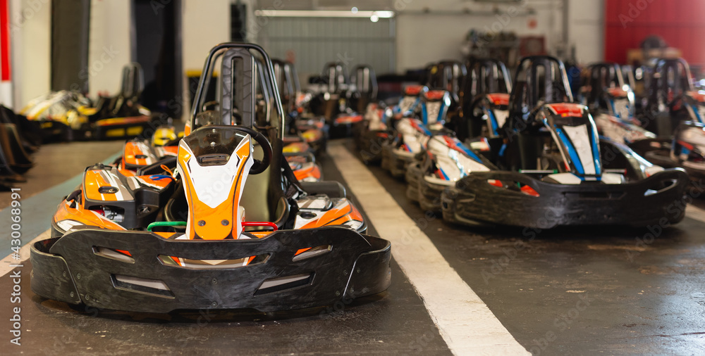View of driving cars for karting in sport club indoor, nobody