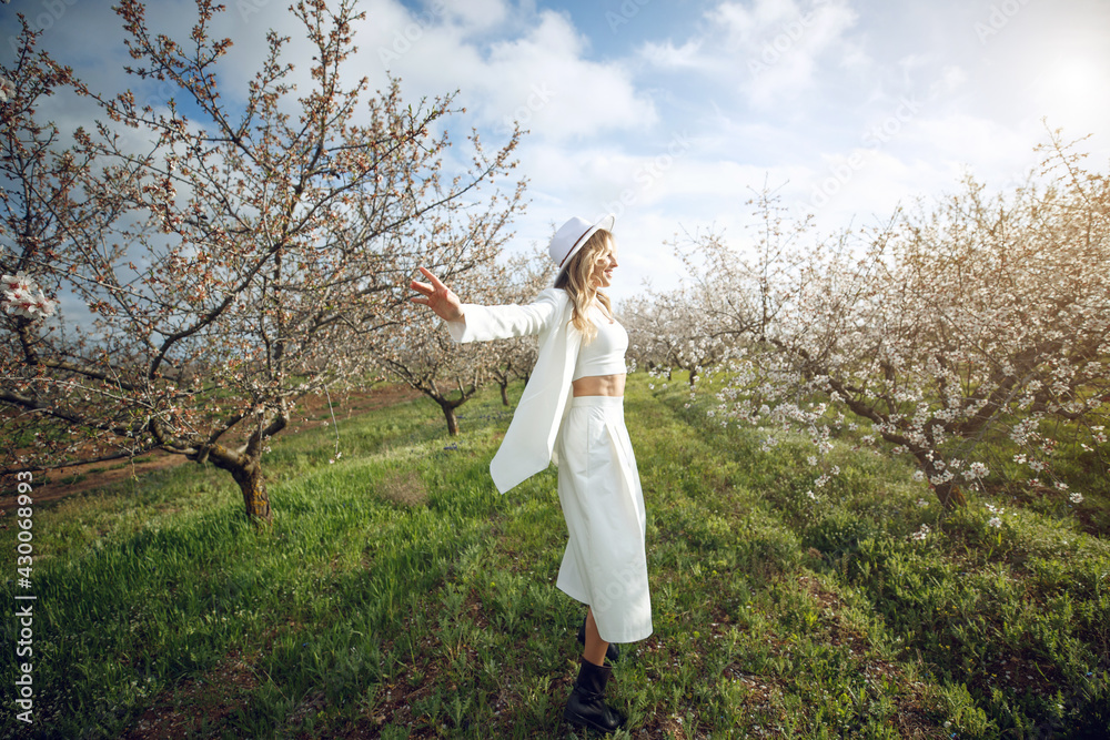 Woman in a blooming garden. Beautiful woman in nature. High quality photo. Woman in a blooming garden. Beautiful woman in nature. High quality photo.
