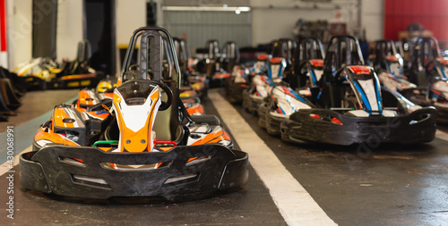 View of driving cars for karting in sport club indoor, nobody