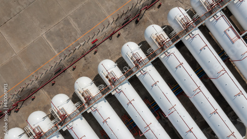 Aerial view natural white gas tank and pipeline, Tank storage chemical petroleum petrochemical refinery product at oil and gas storage terminal company.