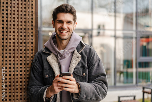 Smiling young white man in casual cothes photo