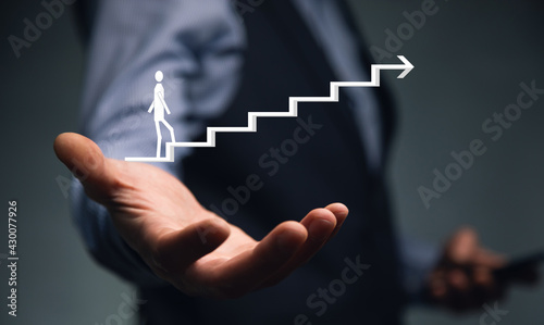 man holding phone with stairs icon