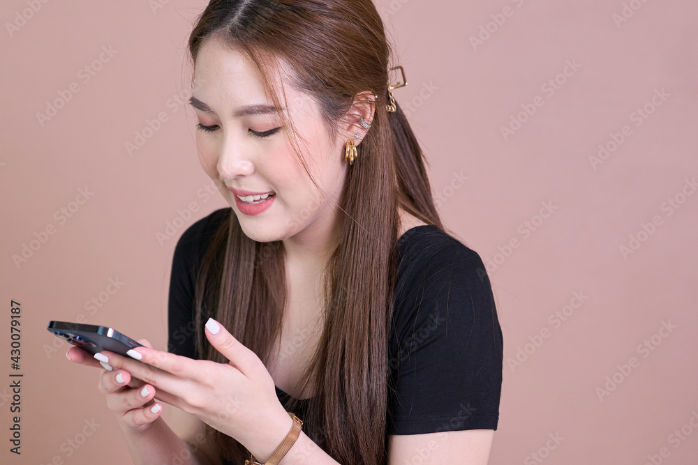 teen girl checking social media holding smartphone at home