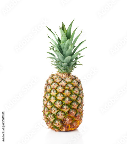 Pineapple with green leaves isolated on white background