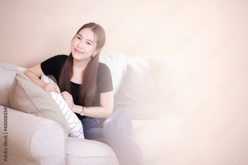 Young attractive Asian woman relaxing at home Young attractive Asian woman relaxing at home