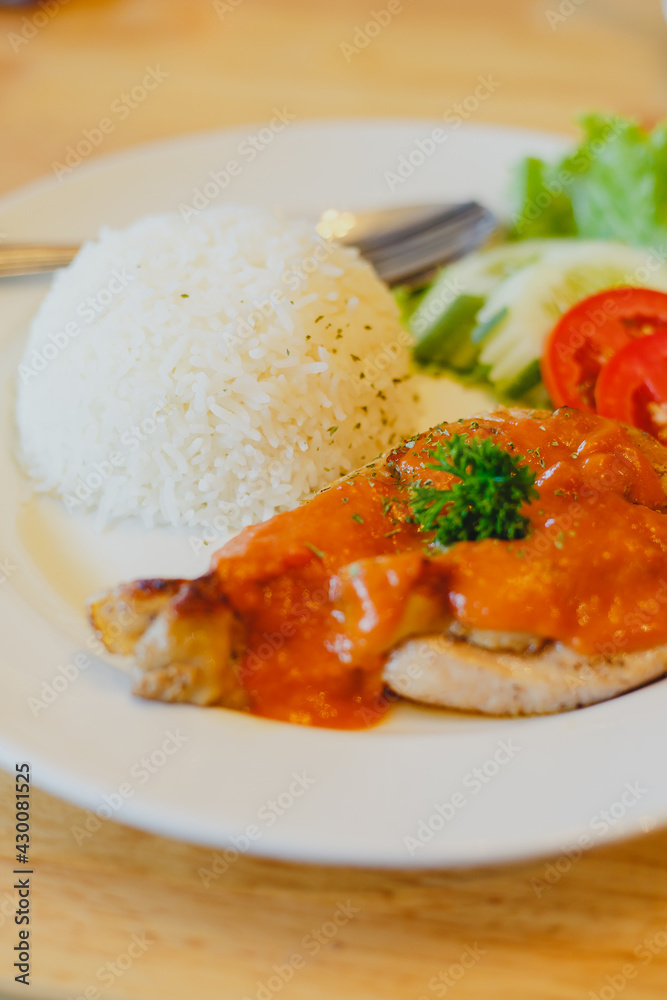 Rice with chicken steak on a plate restaurant cafe
