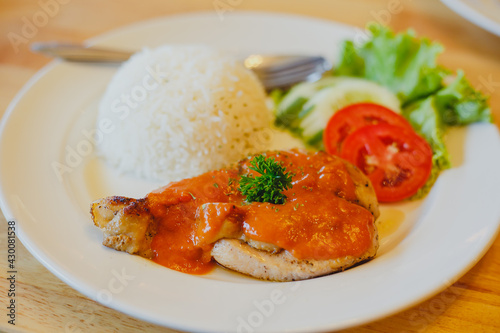 Rice with chicken steak on a plate restaurant cafe