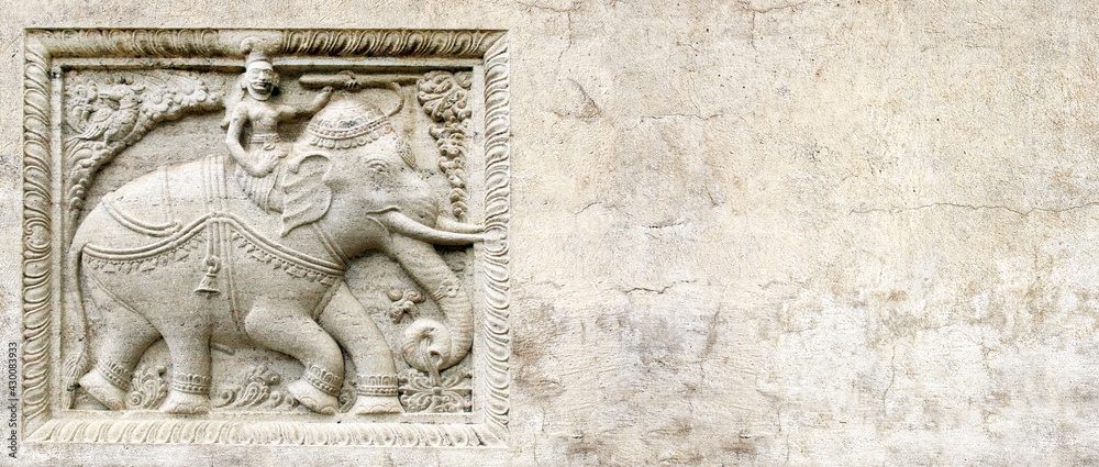 Grunge background with stone texture and bas-relief with elephant rider