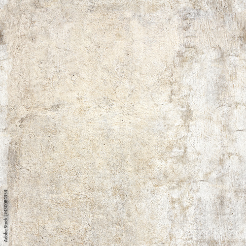 Texture of old wall with cracked stucco of beige color