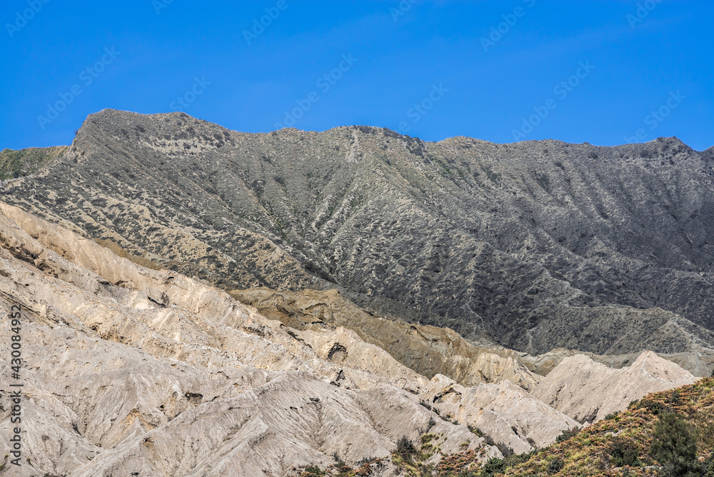 Bromo mountain crater near Batok volcano. Bromo is an active volcano and Tengger massif in Tengger caldera in East Java, Indonesia. Bromo Tengger Semeru National Park. Viewpoint from desert.