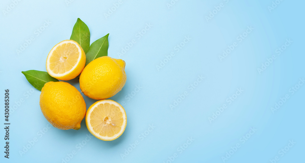 Fresh ripe lemons on blue background Fresh ripe lemons on blue background