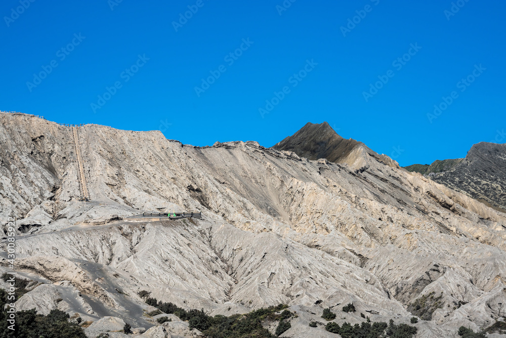 Bromo mountain crater near Batok volcano. Bromo is an active volcano and Tengger massif in Tengger caldera in East Java, Indonesia. Bromo Tengger Semeru National Park. Viewpoint from desert.