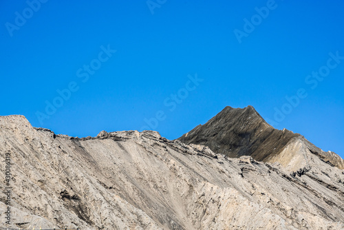 Bromo mountain crater near Batok volcano. Bromo is an active volcano and Tengger massif in Tengger caldera in East Java, Indonesia. Bromo Tengger Semeru National Park. Viewpoint from desert.