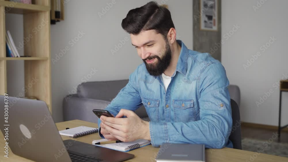 Side view of caucasian man viewing social network feed via smartphone app Side view of caucasian man viewing social network feed via smartphone app