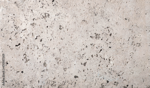 beige concrete wall background with texture and scuffs