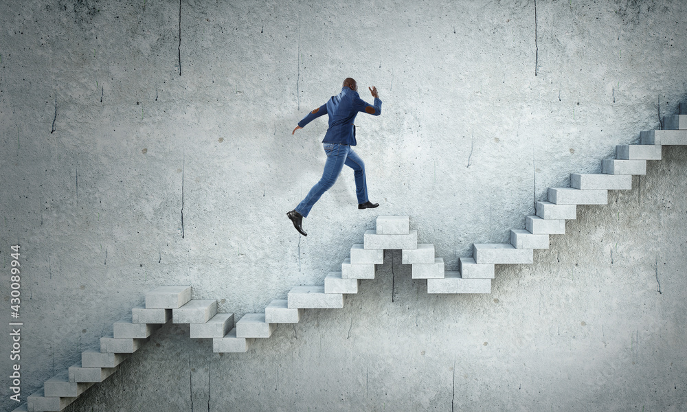 Image of businessman walking upstairs