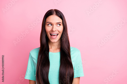 Photo of young beautiful lovely happy excited girl look copyspace see big sale isolated on pink color background