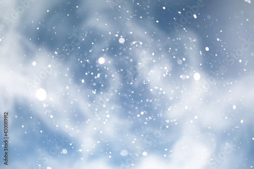 blue snowfall bokeh background  abstract snowflake background on blurred abstract blue