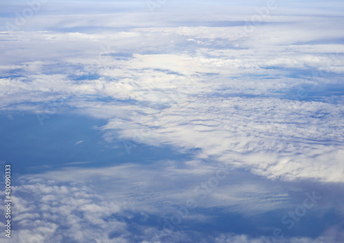 Fototapeta Naklejka Na Ścianę i Meble -  Cloudy blue sky taken from the airplane.