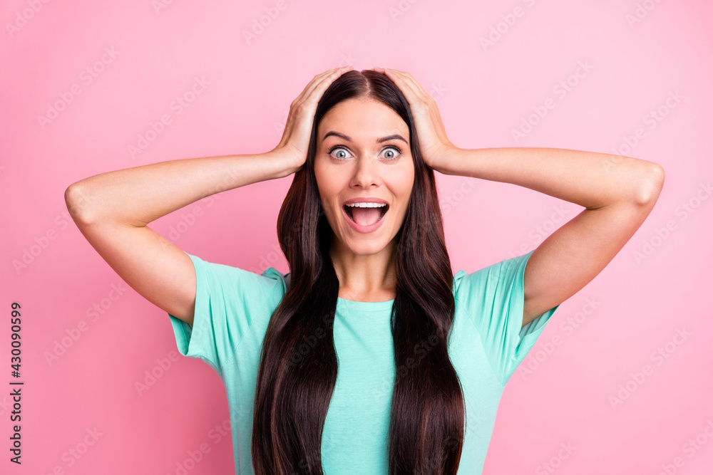 Fototapeta premium Photo of young attractive excited happy positive amazed girl hold hands head isolated on pink color background