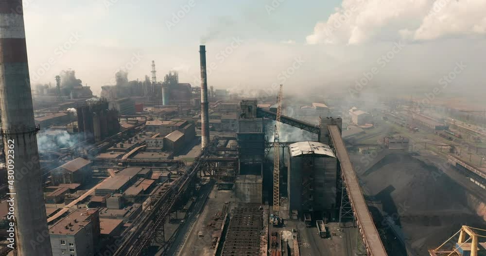 Aerial view. Emission to atmosphere from industrial pipes. Smokestack pipes shooted with drone. Aerial view. Emission to atmosphere from industrial pipes. Smokestack pipes shooted with drone.