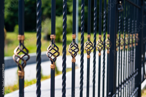 Metal fashion fence. Decorative wrought iron fence