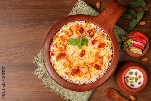 Vegetable biryani biriyani ,  Hyderabadi Shahi Pulao and raita Pilaf Basmati rice dish Indian spices Kerala India Sri Lanka Pakistan. Ghee rice, Lemon rice, boiled white rice photo