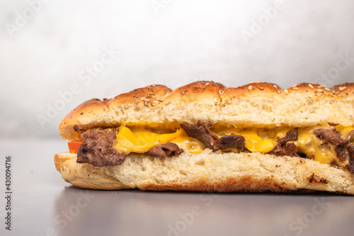 fresh bread sandwich with meat and cheese in a cut