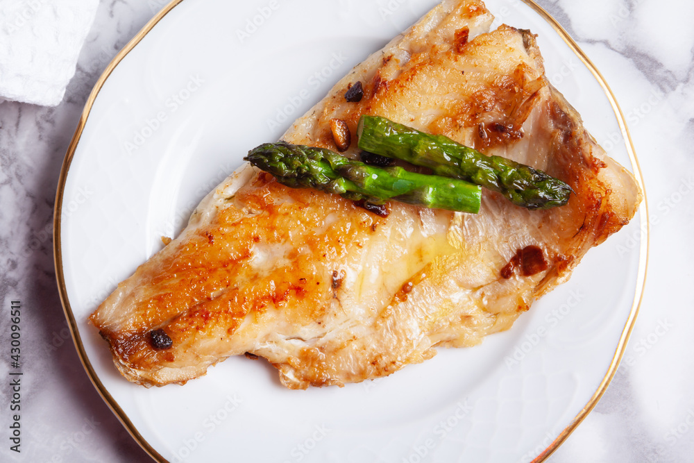 Top view of sea bass fillet with asparagus Top view of sea bass fillet with asparagus