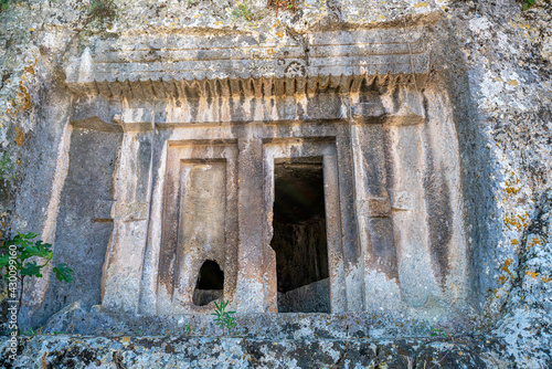 The scenic view of The Tomb of Amyntas, also known as the Fethiye Tomb, is an ancient Greek rock-hewn tomb at ancient Telmessos, in Lycia, currently in the district of Fethiye in Muğla. photo