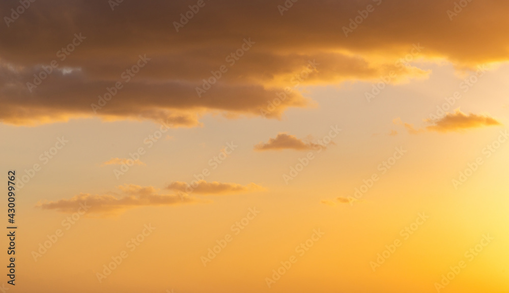 Colorful cloudy sky at sunset. Sky texture, nature background.