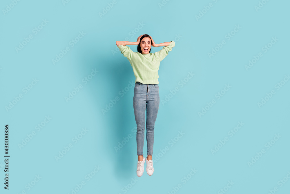 Fototapeta premium Full length body size view of pretty amazed thin cheerful girl jumping having fun good news reaction isolated over bright blue color background