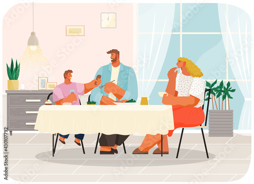 Happy family dining at home. Family members smiling mother, father and son sitting together at table and eating lunch in living room interior. Parents spend time with children, festive dinner