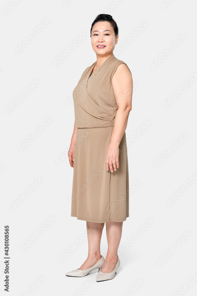 Asian woman in oversized brown blouson dress apparel Asian woman in oversized brown blouson dress apparel