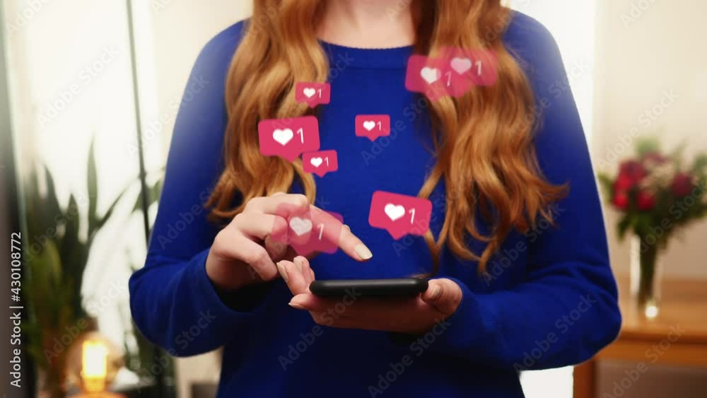 Young girl receive likes using phone social media network application. Animation like icons. Social, love, success, influencer concept animation on living room background