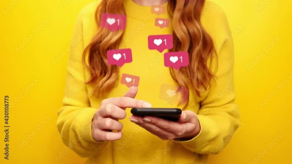Young girl receive likes using phone social media network application. Animation like icons. Social, love, success, influencer concept animation on yellow background