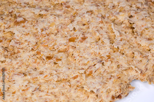 Flat rye-wheat crispbread, fragment close-up in selective focus