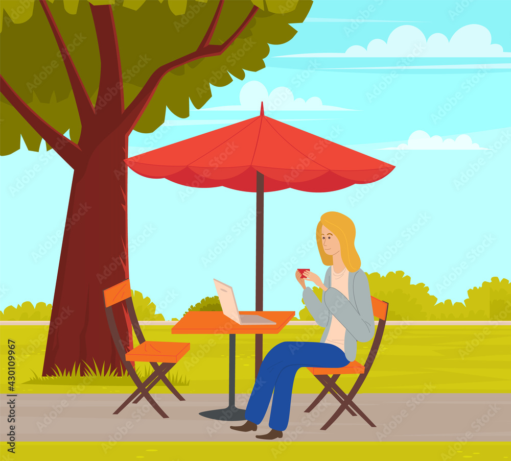Fototapeta premium Girl with laptop is doing her tasks. Woman is working on computer freelance outdoors in city park. Female character relaxing in summer park over cityscape. Freelancer sitting at table under umbrella