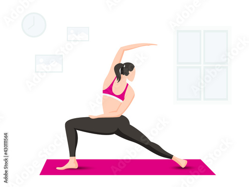 Woman exercising on mat indoor 