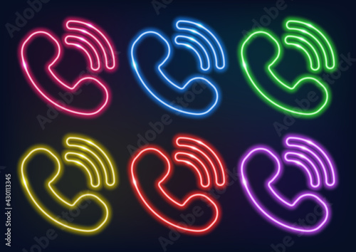 Neon sign. Set of neon handsets of different colors. Glowing lines on a dark background.