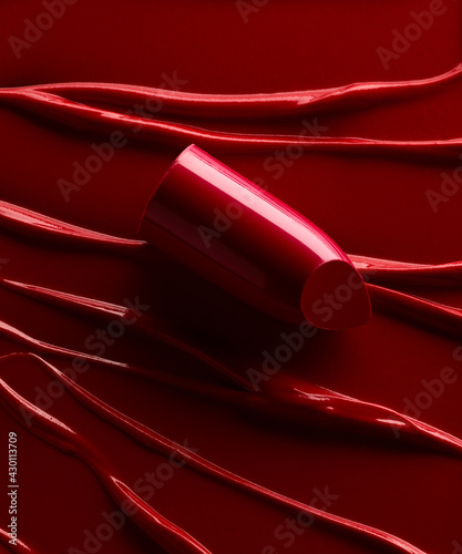 Red lipstick over smudged lipstick background