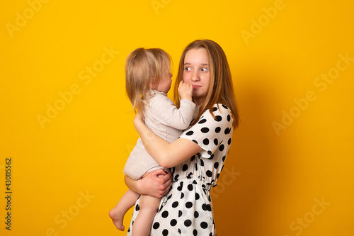 Cute big sister admiring her baby sister. Adorable teen girl holding her new baby girl sister. Kids with large age gap. Big age difference between siblings.