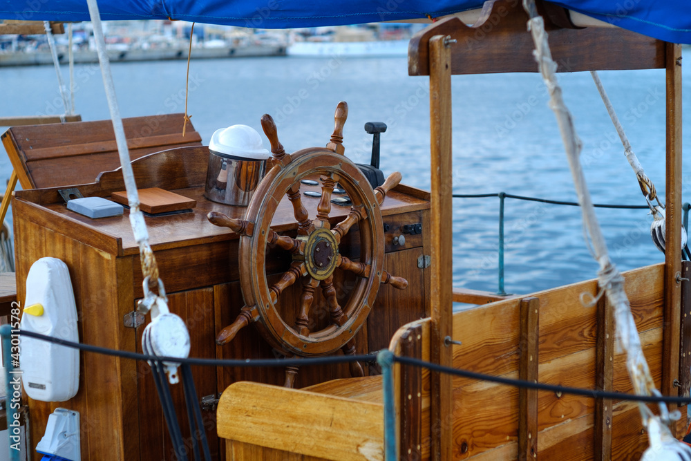 old ship wooden rudder traditional nautical steering wheel - obrazy, fototapety, plakaty 
