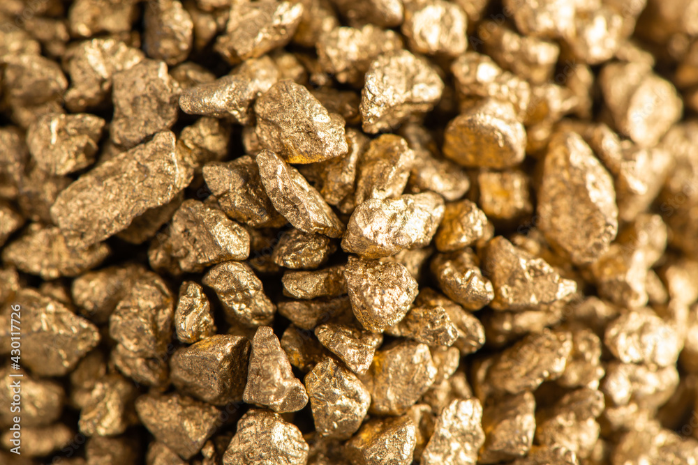 Macro view on handful of pieces of gold Macro view on handful of pieces of gold