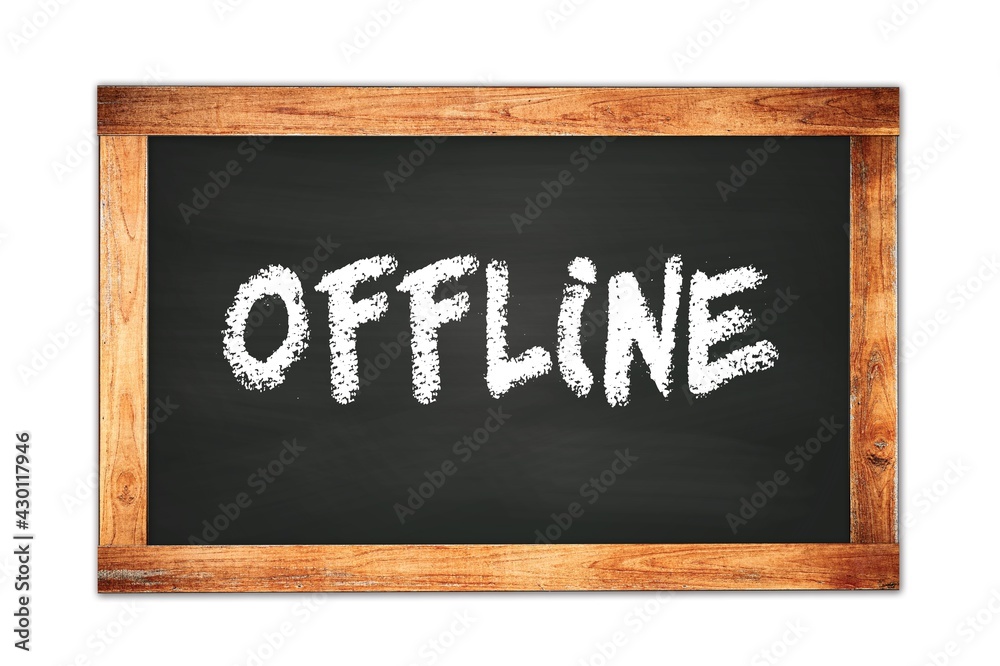 OFFLINE text written on wooden frame school blackboard. OFFLINE text written on wooden frame school blackboard.
