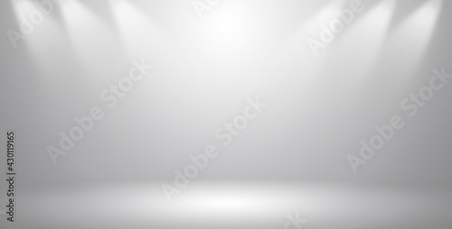 Empty dark gray room with gradient gray abstract background and decorated with spotlights for display your product.