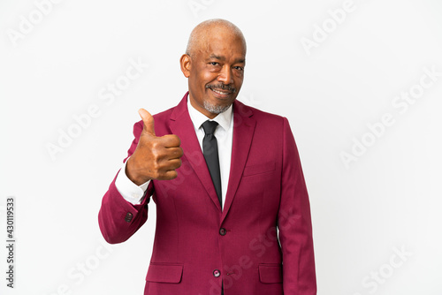Cuban senior isolated on white background with thumbs up because something good has happened