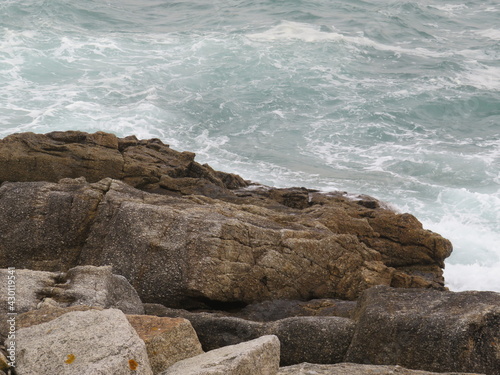 waves creating new forms on the rocks