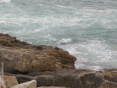 waves crashing on rocks and creating new forms